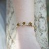 Gold bracelets with flowers