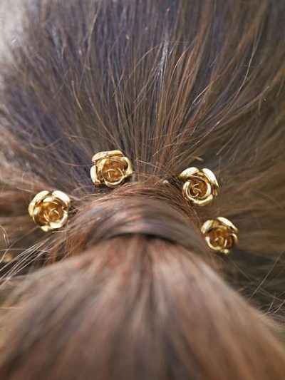 Bride wearing flower hair pins