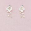 Earrings with single flower and pearls.