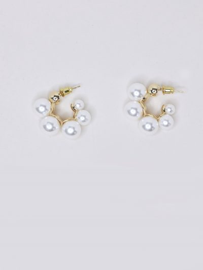 Modern gold pearl hoop earrings.